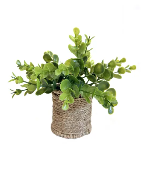 Kunstpflanze im Seegrastopf