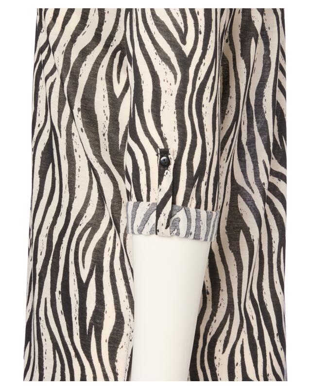 بلوزة بنقوش للنساء، بطبعة زيبرا (KiK Gemusterte Bluse (Zebradruck)) — KiK, منتج ألماني أصلي في المغرب