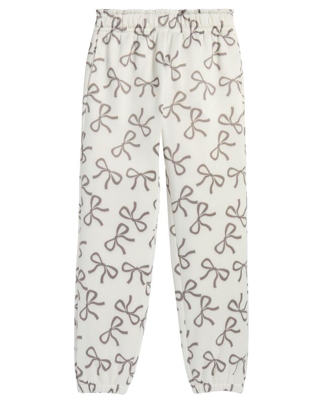 سويت شيرت + سروال جوغينغ بفيونكات للبنات، كريمي (KiK Sweatshirt + Jogginghose mit Schleifen (creme)) — KiK, منتج ألماني أصلي في المغرب